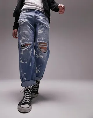 Topman rip and bleach relaxed jeans in mid wash