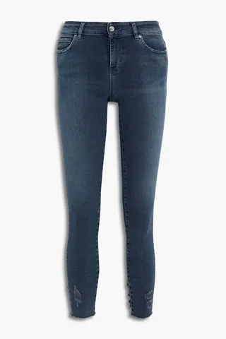 Distressed mid-rise skinny jeans