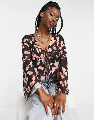 ASOS DESIGN volume sleeve sheer blouse with corset bust in butterfly print