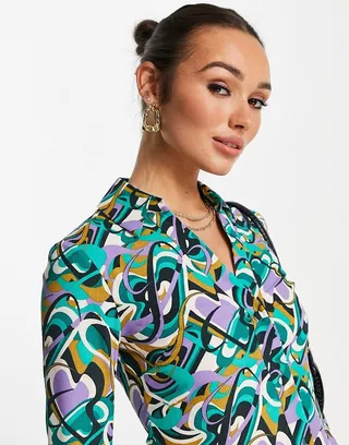 ASOS DESIGN slim fit button front shirt in purple and green swirl
