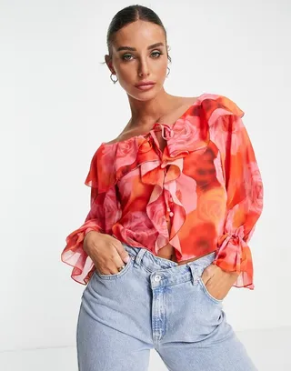 ASOS DESIGN ruffle front blouse with tie in blurred rose print