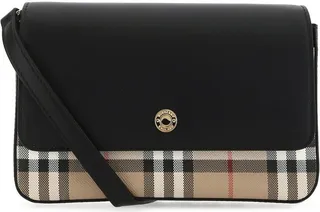 Crossbody bag realized in leather with contrasting printed e-canvas insert characterized by magnetic button closure.