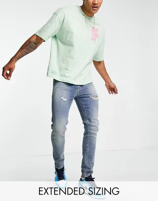 ASOS DESIGN skinny jean in mid wash with rips