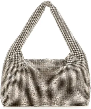 Handbag realized in fabric entirely covered by rhinestones characterized by magnetic button closure.