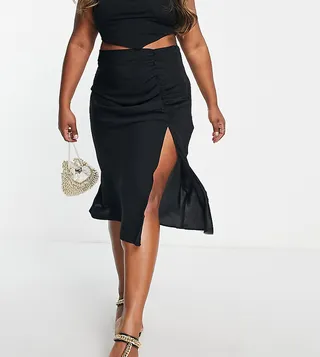 ASOS DESIGN Curve midi skirt with ruched side and button detail in black