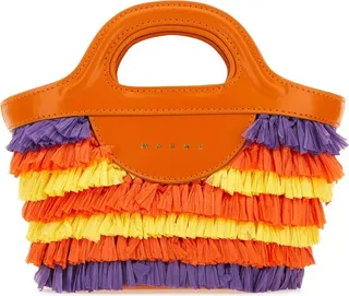 Fringed handbag realized in fabric with smooth leather inserts characterized by print logo at the front.