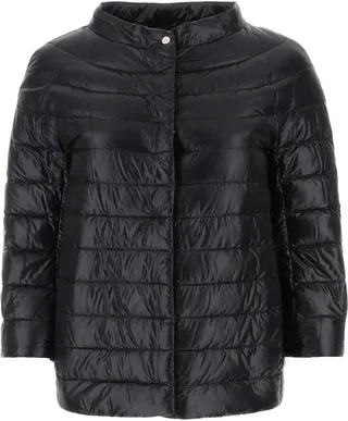 Lightweight down jacket realized in quilted nylon enriched by metal logoed plate at the back.