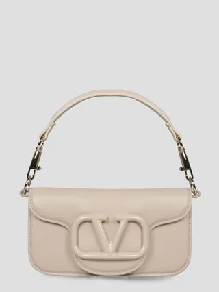 Valentino Garavani Locò shoulder bag in calfskin leather with enamel tone-on-tone VLogo Signature detail.