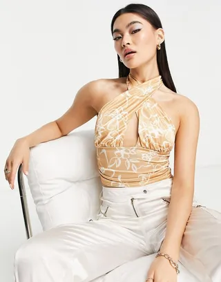 ASOS DESIGN satin cross front halter crop top in floral