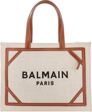Canvas shoulder bag with embroidered logo on the front