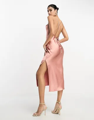 ASOS DESIGN Bridesmaid cami midi slip dress in high shine satin with lace up back in soft pink