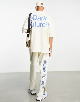 ASOS Dark Future relaxed sweatpants with side slits and logo puff prints in off white - part of a set