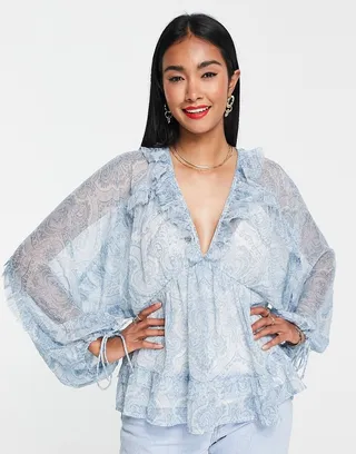 ASOS DESIGN blouse with raw ruffle edge & volume sleeves in blue paisley print