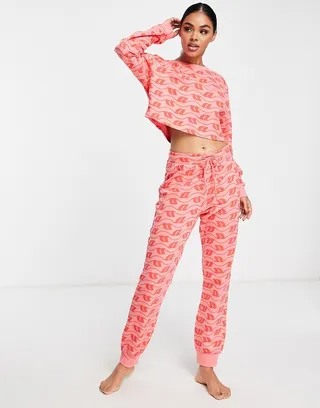 ASOS DESIGN lounge monogram print sweatshirt & sweatpants set in pink & red