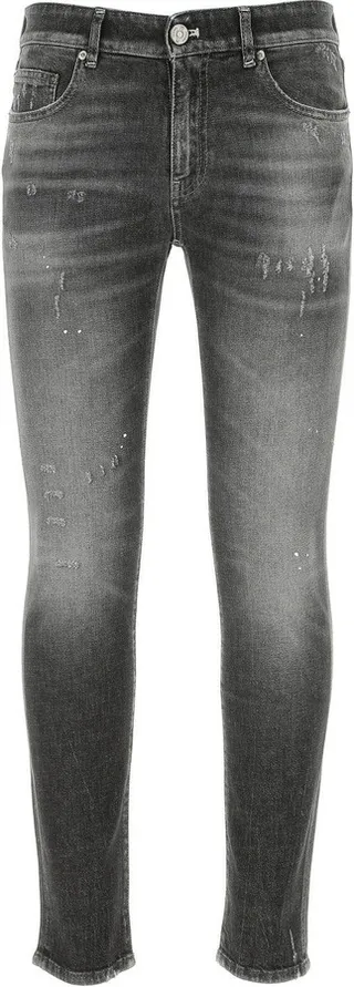 Skinny jeans realized in stonewashed and distressed stretch cotton denim enriched by logoed label at the back.