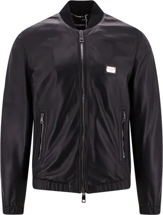 Leather jacket with metal logo patch