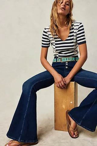 After Dark Mid-Rise Flare Jeans by We The Free at Free People