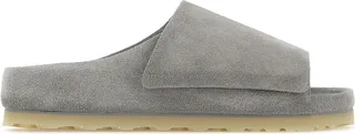 Slippers created in collaboration with Fear Of God realized in suede characterized by embossed logo on the side and adjustable velcro band.