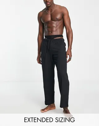 ASOS DESIGN jersey lounge bottoms with strappy detail in black