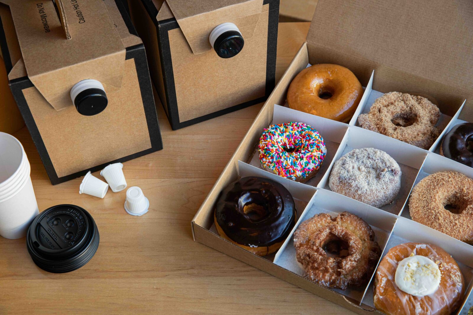 Two catering Joe-to-Go boxes and a dozen donuts.