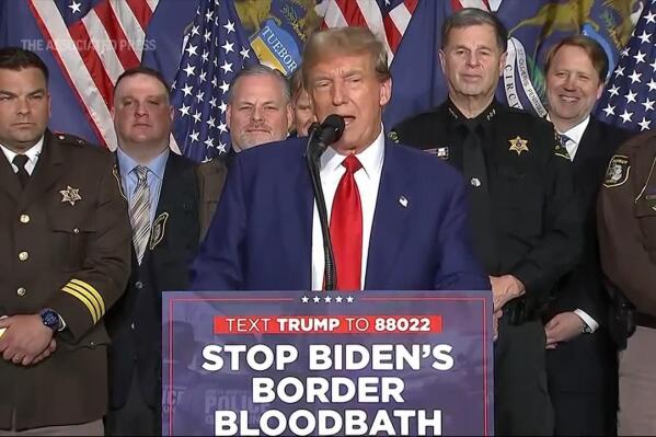 Trump hammers Biden on border policies and crime during visit to pivotal Michigan