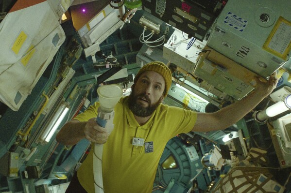 Movie Review: It’s lonely out in space for Adam Sandler in pensive sci-fi psychodrama ‘Spaceman’