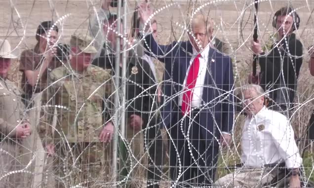 Border crime wave! Donald Trump fist pumps at migrants through barbed wire in bizarre footage