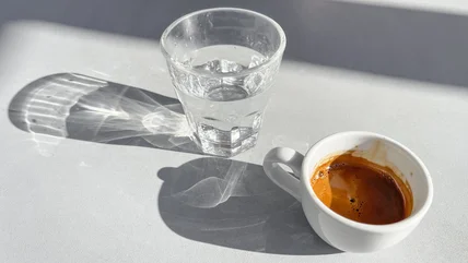 The Reason European Cafes Serve Shots Of Water With Their Coffee