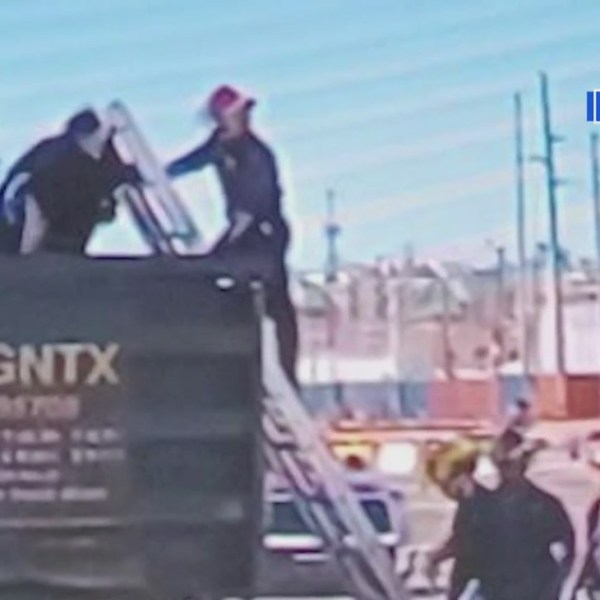 Migrants avoid X-ray scanners inside El Paso rail yard