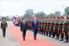 Welcome ceremony for President To Lam held in Vientiane