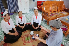 The Muong people’s thread tying around their wrists rituals