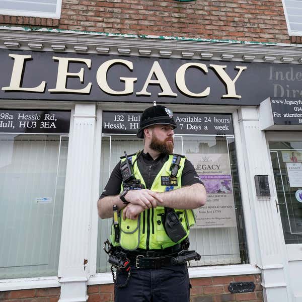 Police remove 34 bodies from English funeral home and arrest 2 for fraud and preventing burial