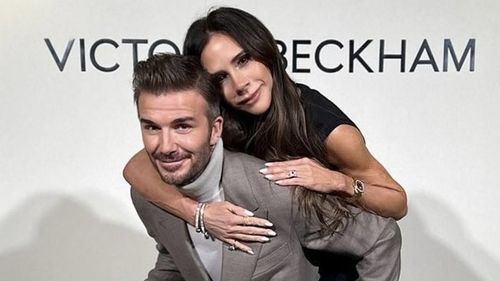 Victoria Beckham guzzles champagne and posts adoring tribute to David after fashion show is crashed