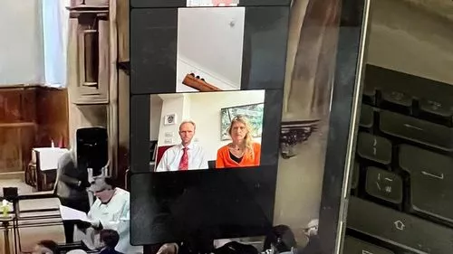 Moment woman dials into funeral by Zoom while showering as mourners in church see all