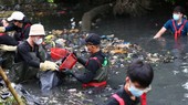 Young people join hands to clean up trash-choked canals