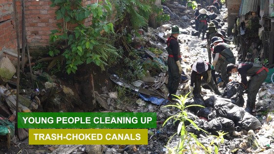 Young people cleaning up trash-choked canals