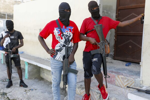 Politicians seek new alliances to lead Haiti as gangs take over and premier tries to return home