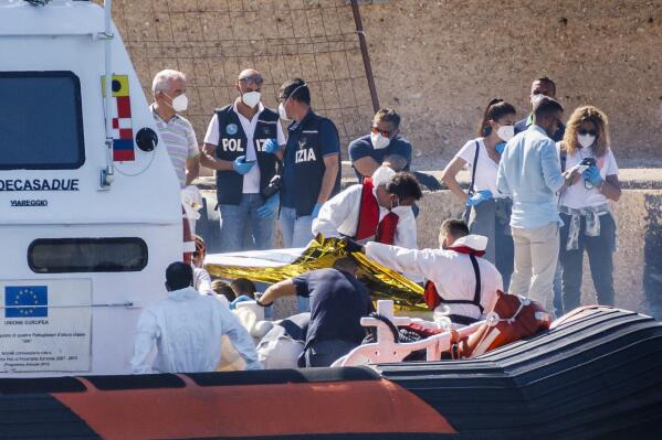 Italian coast guard finds bodies of 2 minors on migrant boat