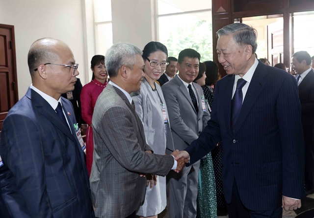 President Tô Lâm meets Vietnamese people in Laos