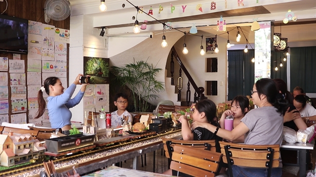 Restaurant serves diners with train models