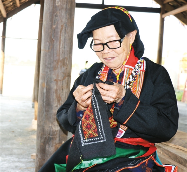 Ethnic woman helps preserve traditional embroidery