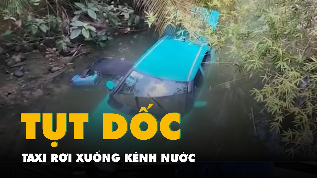 Taxi tụt dốc rơi xuống kênh nước, tài xế chui qua cửa sổ thoát nạn