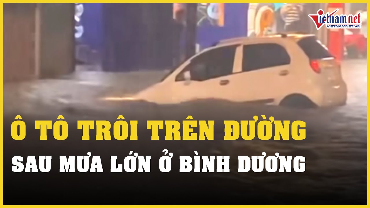 Mưa lớn gây ngập lụt ở Bình Dương, nước dâng cao khiến ô tô trôi trên đường | Báo VietNamNet