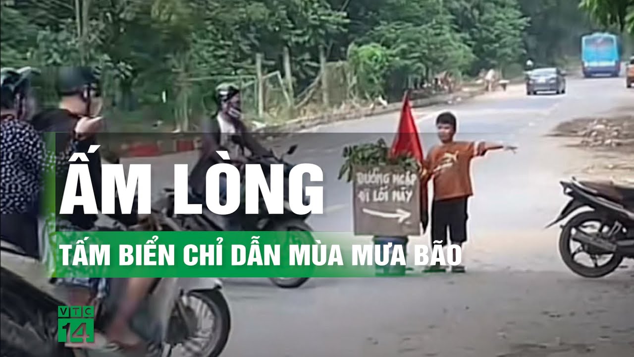 Tấm biển giúp người dân thoát khỏi vùng nước ngập ở đại lộ Thăng Long | VTC14