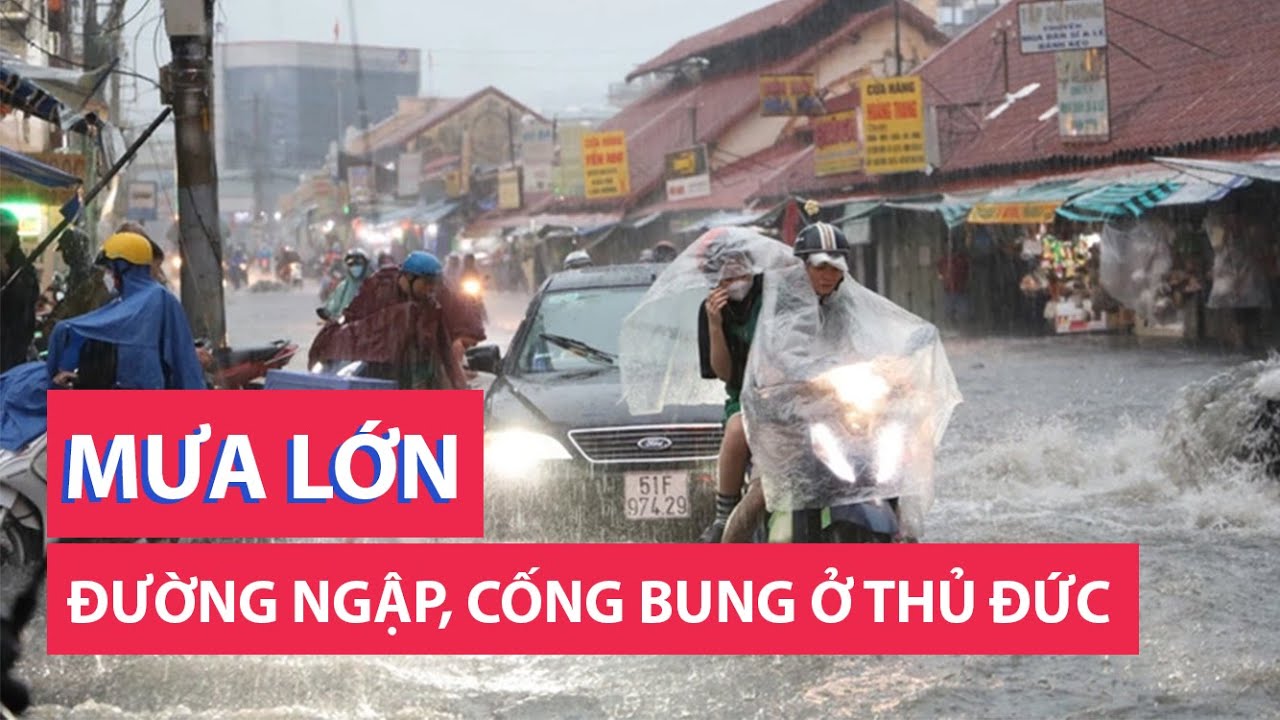 Mưa lớn ở khu chợ Thủ Đức: đường lại ngập, cống lại bung