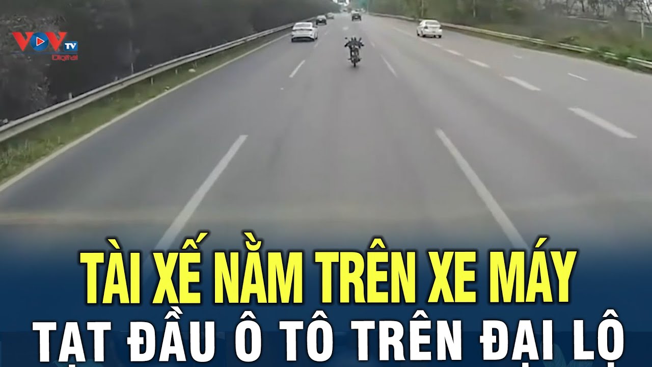 Tài xế nằm trên yên xe máy, tạt đầu ô tô trên Đại Lộ Thăng Long