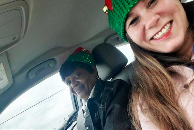 Mary and Adrianne smile while they are in a car. 