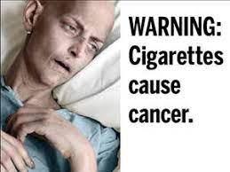 Warning: Cigarettes cause cancer with an individual in the background