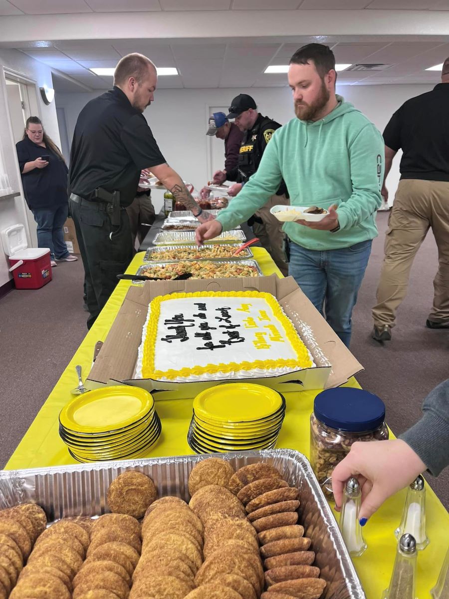 People serving themselves food.