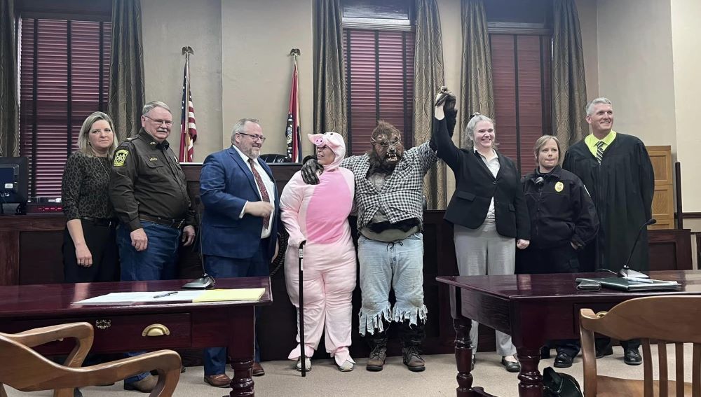 County members, Sheriff, and someone dressed as a pig and a wolf.